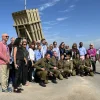 U.S. lawmakers pose with an Iron Dome battery while touring Israel. February 2022. Credit: AIPAC/Twitter.