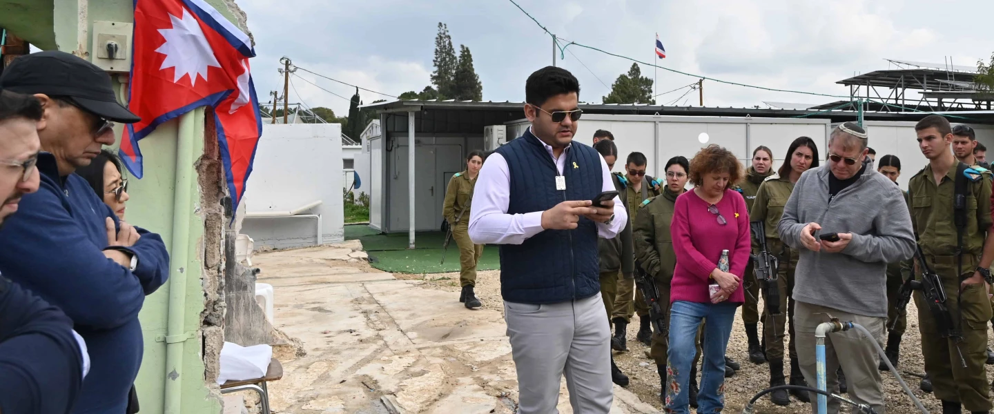 Pravesh Jiral commemorates his murdered countrymen in Kibbutz Alumim, Israel on Feb. 13, 2025. Photo by Canaan Lidor.