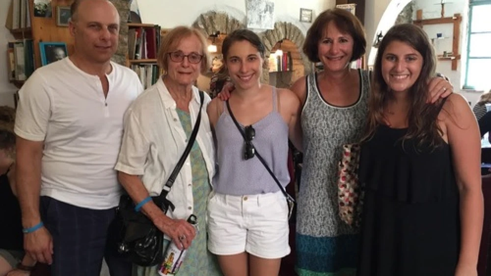 Click photo to download. Caption: In Israel, Eliana Rudee (center) is pictured with her father (far left), grandmother, mother, and a friend who also made aliyah. Credit: Christa Lilly.