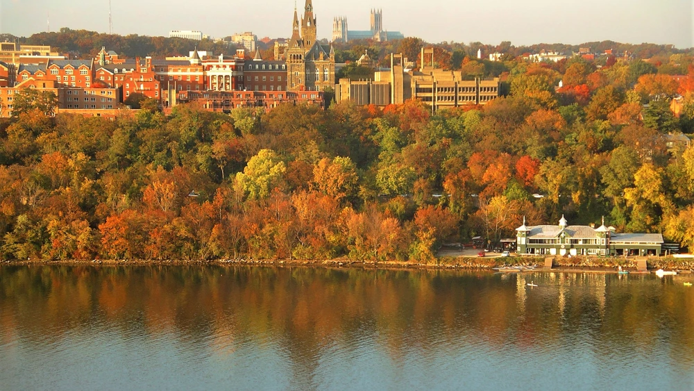 Georgetown University's main campus. Washington National Cathedral is visible above campus, and the Washington Canoe Club is in the lower right on the Potomac River. Credit: Patrickneil via Wikimedia Commons.