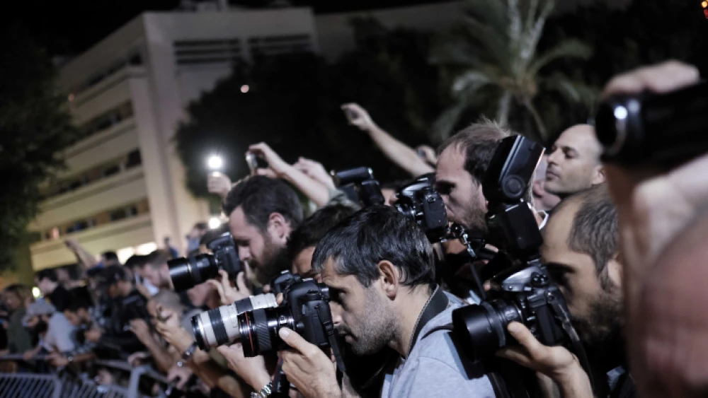 Photojournalists capture protests in central Tel Aviv against a controversial agreement reached over the past few months between the government and large energy companies over natural-gas production, Nov. 14, 2015. Photo by Tomer Neuberg/Flash90.