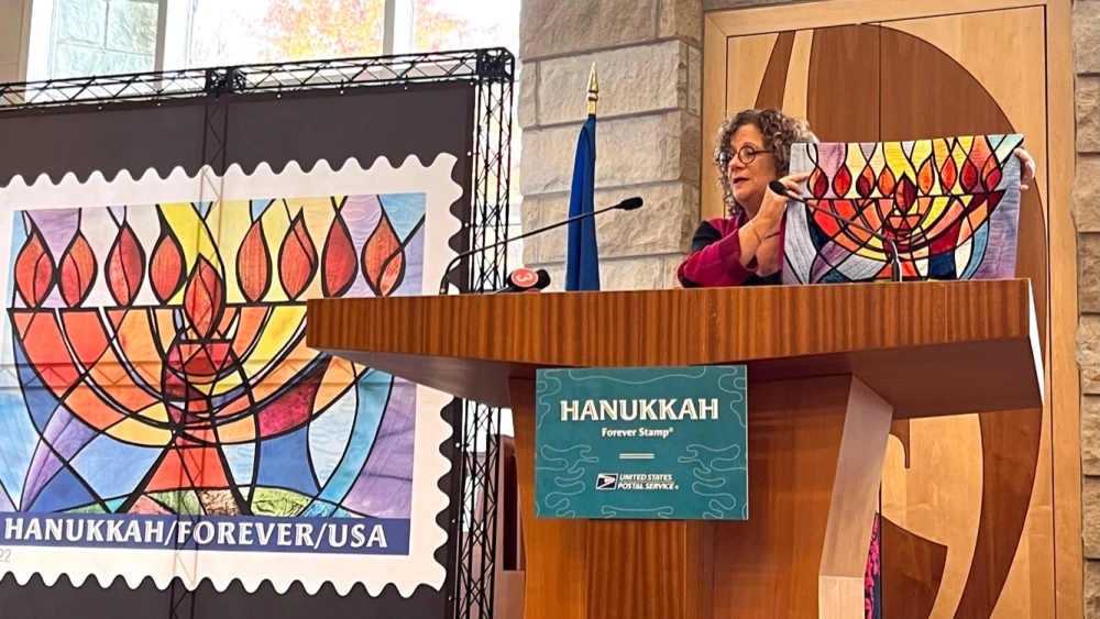 Jeanette Kuvin Oren presents her “Hanukkah Forever” postage stamp at Temple Emanu El in Orange Village, Ohio, Oct. 20. Credit: Courtesy Jeanette Kuvin Oren.