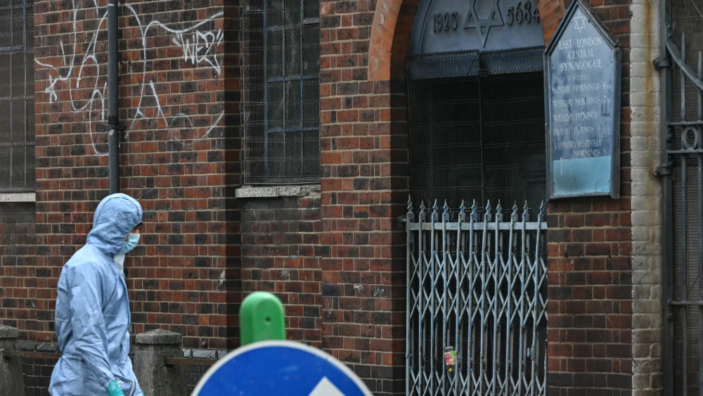 A police forensics officer works at the scene outside a former synagogue in east London following a suspected arson, May 5, 2026. Photo by Justin Tallis/AFP via Getty Images.