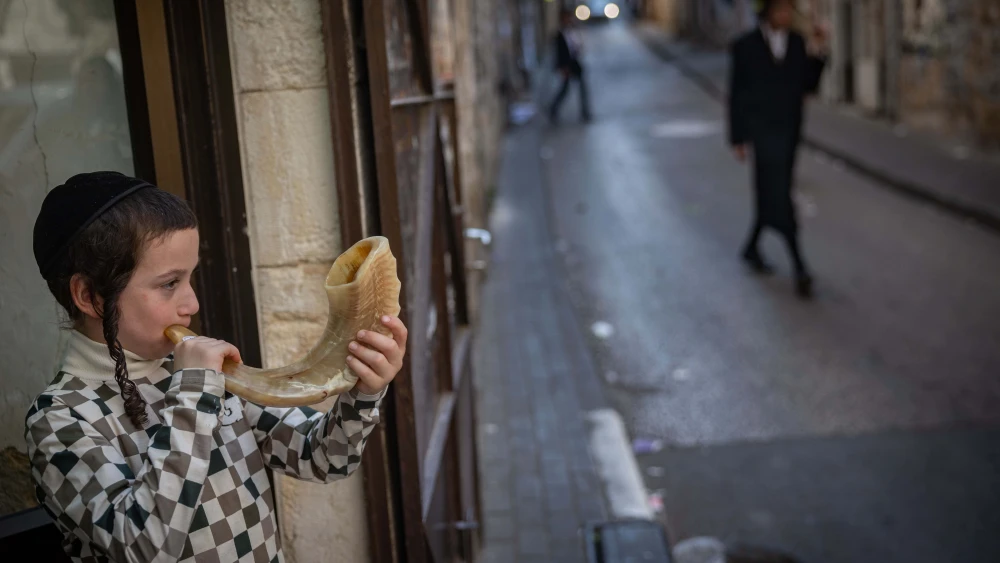Boy Blowing Shofar in Jerusalem