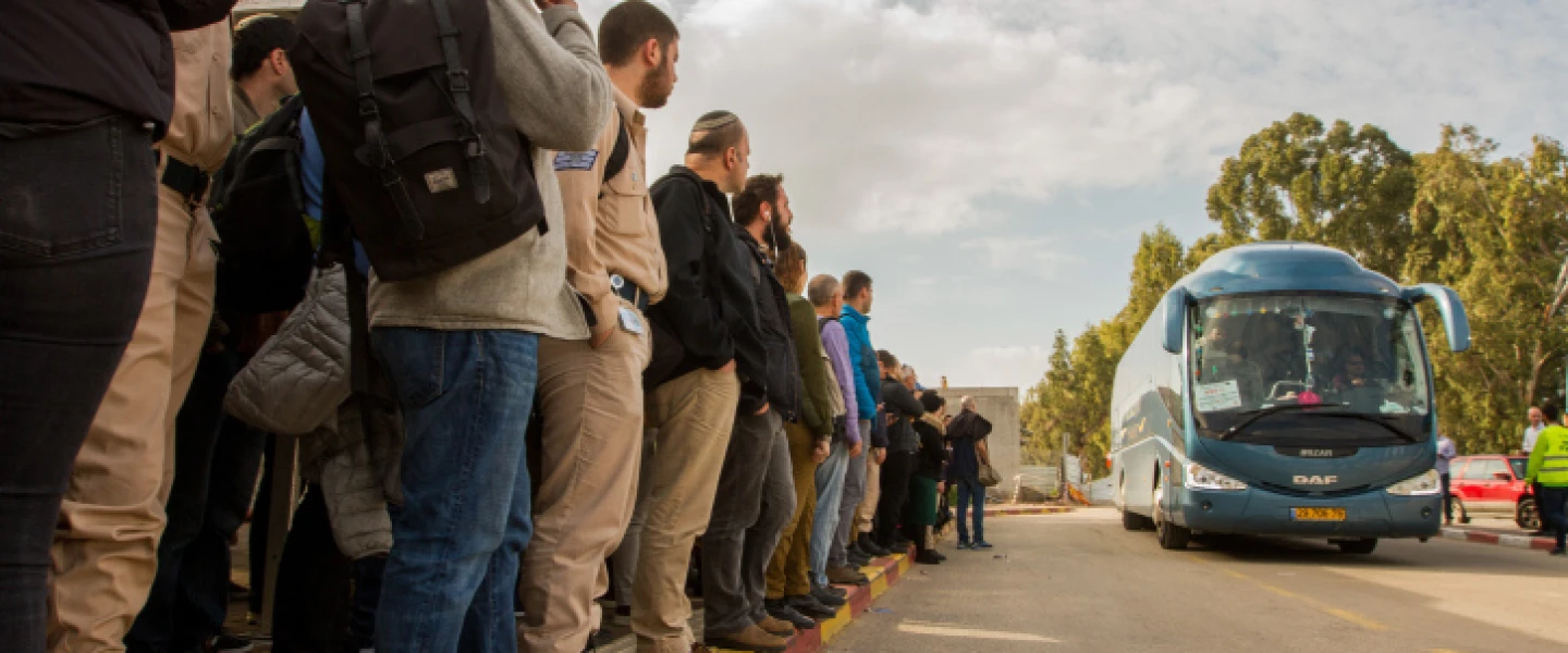 Passengers wait for shuttles to Tel Aviv at the Beit Yehoshua train station, Feb. 19, 2018. Photo by Flash90.