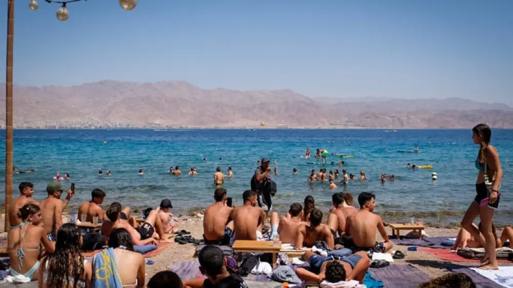 Israelis crowd a beach at Eilat on the Red Sea, Aug. 9, 2023. Photo by Noam Revkin Fenton/Flash90.