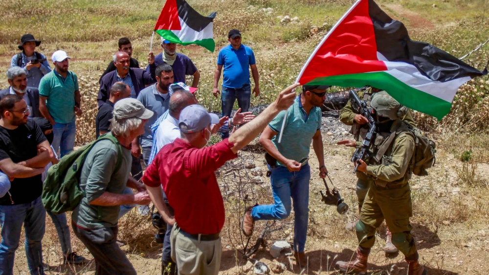 Palestinians and left-wing activists clash with Israeli security forces in the village of Beit Dajan in Samaria, May 12, 2023. Photo by Nasser Ishtayeh/Flash90.