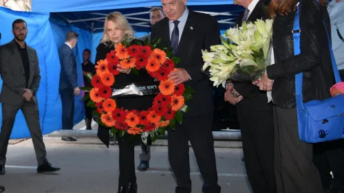 Israeli Prime Minister Benjamin Netanyahu and his wife, Sara, lay a wreath at the site of a car-ramming attack in Tel Aviv, April 16, 2023. Photo by Amos Ben-Gershom/GPO.