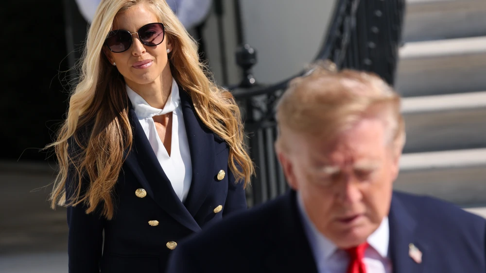 White House Press Secretary Katie Zacharia joins U.S. President Donald Trump as he departs on the South Lawn of the White House in Washington, D.C., on Oct. 13, 2026. Photo by Win McNamee/Getty Images.