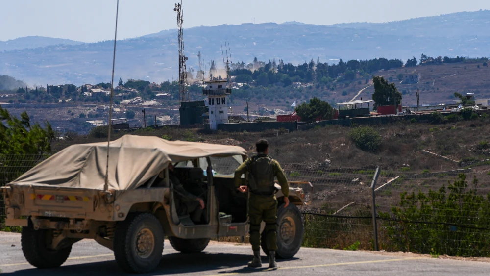 Israeli soldiers look over southern Lebanon from the Northern Israeli border, Aug. 10, 2026. Photo by Ayal Margolin/Flash90.