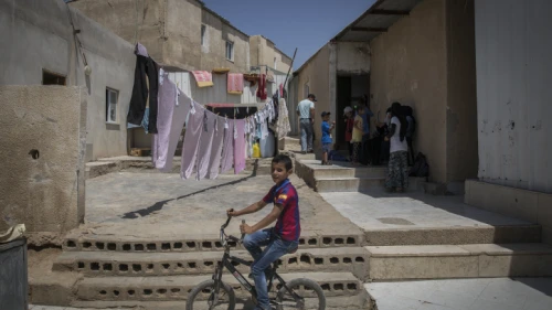 Bedouins seen outside their home in the village of Umm al Hiran in the Negev Desert on Aug. 27, 2015. It is one of about 46 unrecognized Bedouin villages in Israel. Photo by Hadas Parush/Flash90.
