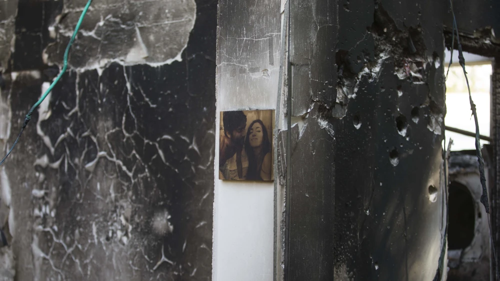 A single photograph of a couple remains on the wall of a bullet-riddled home in Kfar Aza in southern Israel after Hamas terrorists rampaged through the community on Oct. 7, murdering families and taking civilians hostage, Oct. 16, 2023. Photo by Rina Castelnuovo.