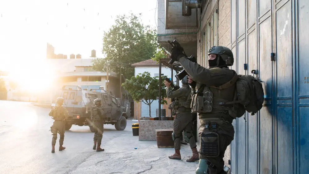 Israel Defense Forces search a West Bank village as part of a manhunt for the perpetrators of a drive-by shooting at Tapuach Junction near Ariel, May 4, 2021. Credit: IDF.