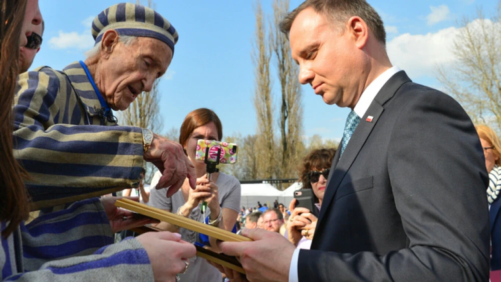Holocaust survivor Edward Mossberg with Polish President Andrzej Duda at a ceremony at the site of the Auschwitz-Birkenau camp in Poland on April 12, 2018. Photo by Yossi Zeliger/Flash90.