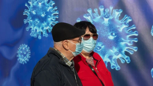 Passersby outside a COVID-19 vaccination center in Jerusalem, on Dec. 31, 2020. Photo by Olivier Fitoussi/Flash90.