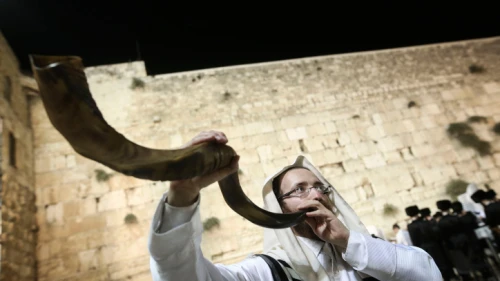 A shofar is blown at the Western Wall in Jerusalem's Old City, at the end of Yom Kippur, Oct. 12, 2016. Photo by Flash90.