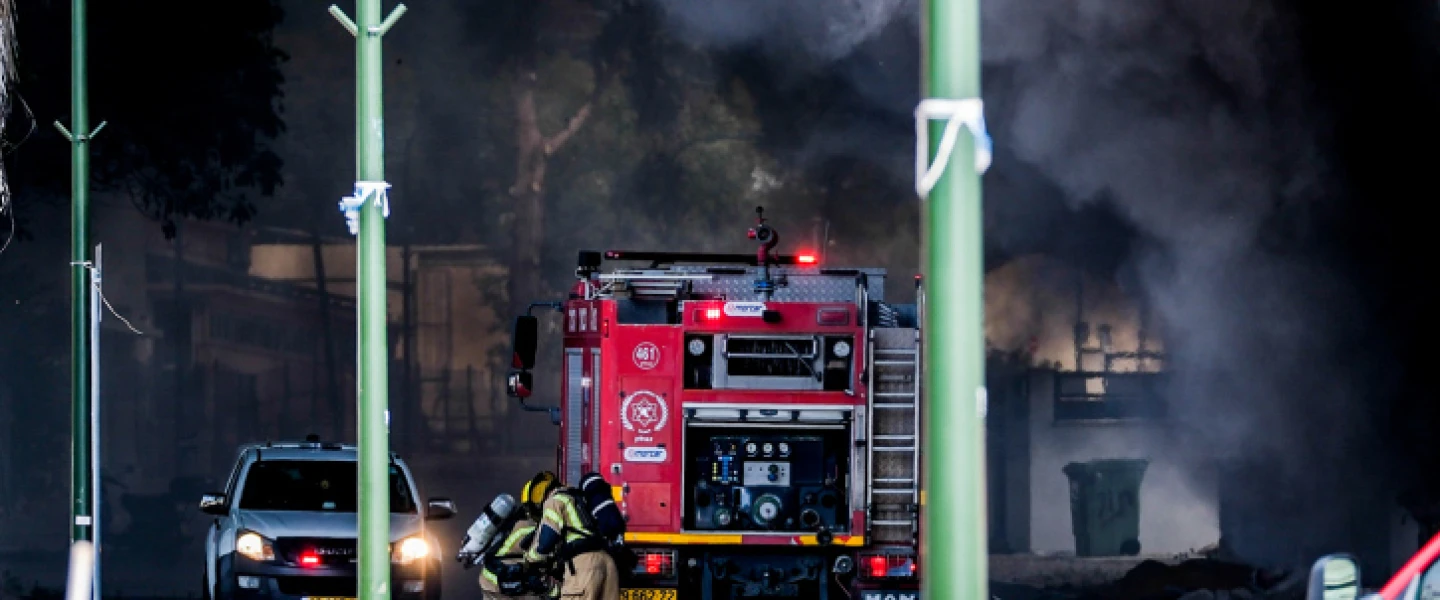 Firefighters try to extinguish a fire in the Israeli town of Shlomi caused by a rocket launched from Lebanon, April 6, 2023. Photo by Fadi Amun/Flash90.