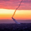 Trails of smoke are seen after rockets are fired from the Gaza Strip towards Israel, Feb. 23, 2023. Photo by Atia Mohammed/Flash90.