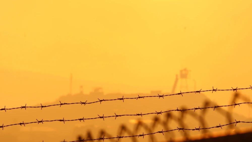 The sun sets over a United Nations outpost in Southern Lebanon, as seen from the northern Israeli town of Manara, July 24, 2006. Photo by Anna Kaplan/Flash90.