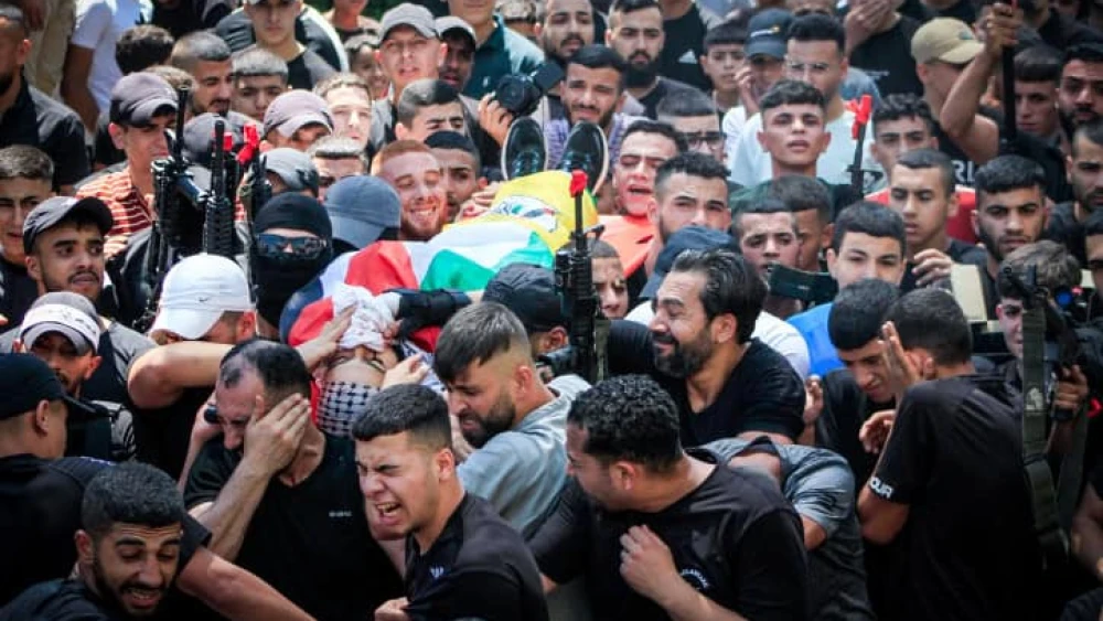 Palestinian gunmen and mourners take part in the funeral of Palestinians kiiled in an Israeli drone attack, in the Balata refugee camp, on Aug. 15, 2024. Photo by Nasser Ishtayeh/Flash90.