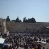A large crowd gathers at the Western Wall on Passover to receive the priestly blessing, known as Birkat Kohanim. Credit: Wikimedia Commons.