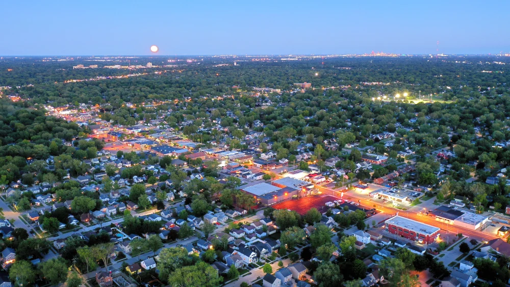 A view of the Detroit skyline on the horizon behind downtown Berkley, Mich., Aug. 11, 2022. Credit: Lrgjr72 via Wikimedia Commons.
