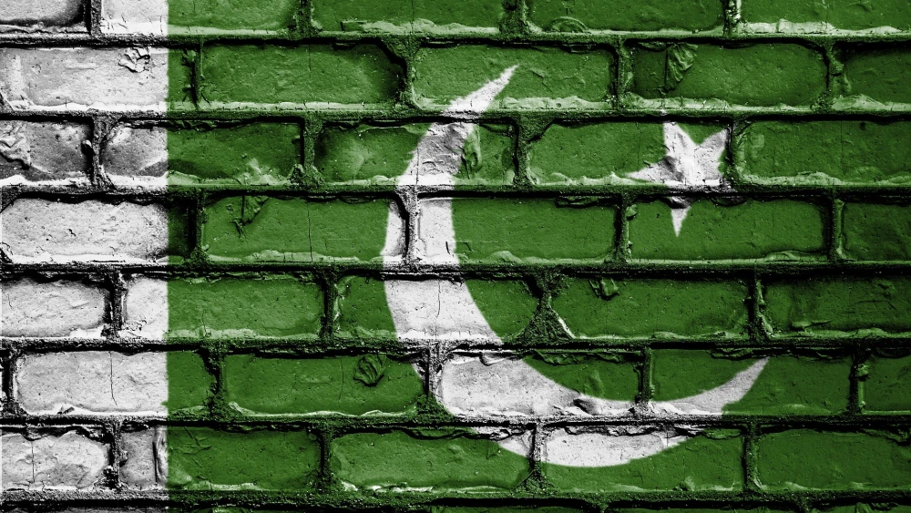The flag of Pakistan featured on a brick wall. Credit: David_Peterson/Pixabay.