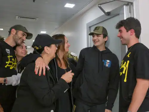 IDF Staff Sgt. Edan Alexander embraces family members during an emotional reunion at Tel Aviv Sourasky Medical Center on May 12, 2025. Photo by Kobi Gideon/GPO.