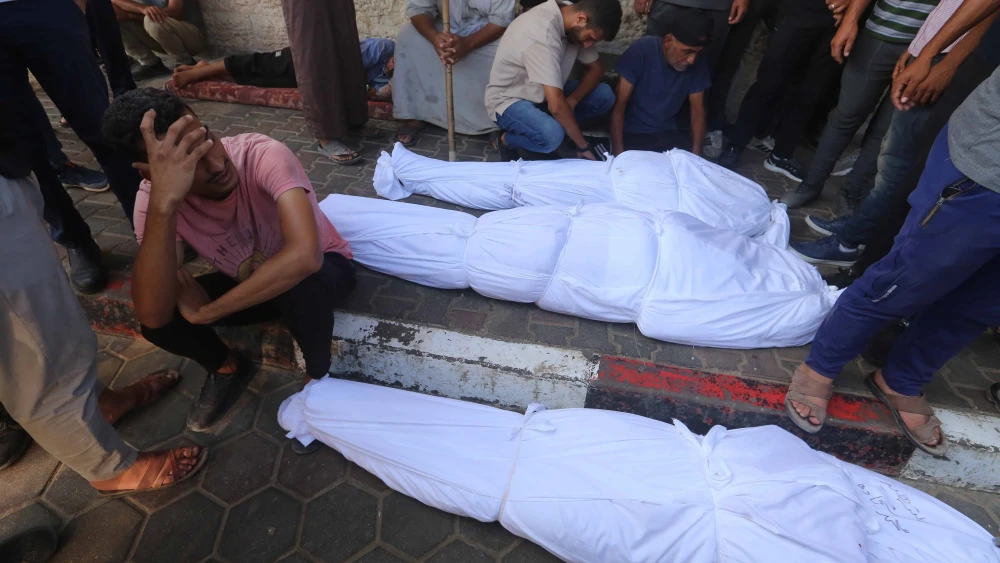 Bodies lie at the entrance to Al-Aqsa Martyrs Hospital in Deir al-Balah, in the central Gaza Strip, on Sept. 7, 2024. Photo by Ali Hassan/Flash90