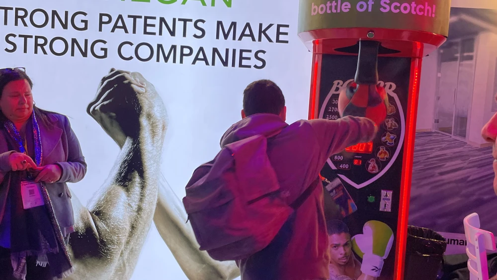 A student tests the punching bag at Cybertech. Photo by Judith Segaloff.