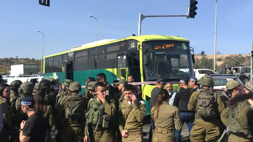 Israeli security personnel at the scene of a terrorist attack on a bus near Neve Daniel in Gush Etzion, south of Jerusalem, March 31, 2022. Photo by Israel Kasnett.