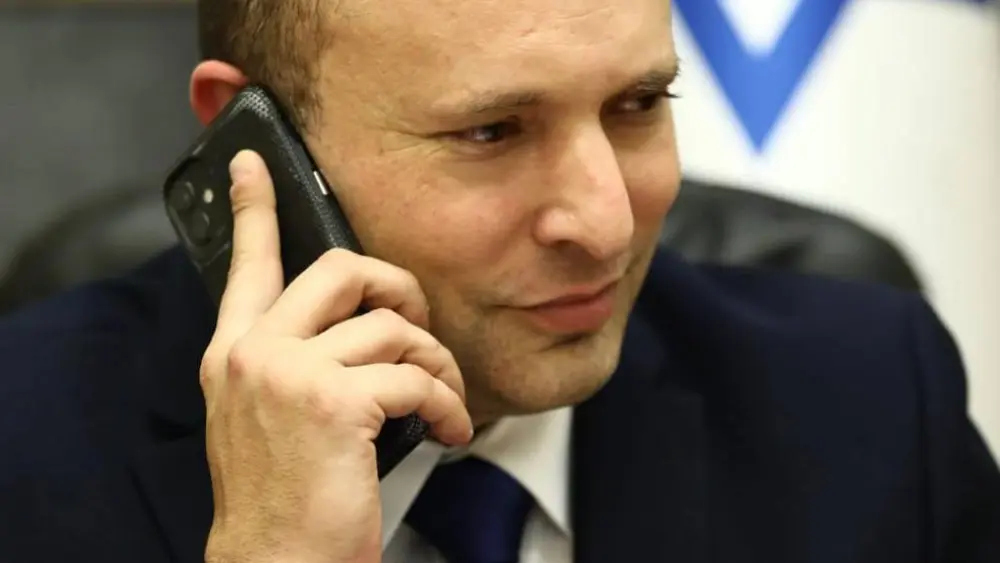 Israeli Prime Minister Naftali Bennett speaking with U.S. President Joe Biden on June 13, 2021. Credit: Ariel Zandberg/GPO.