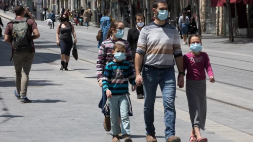 Israelis, face masks required, walk down Jaffa Street in downtown Jerusalem on April 26, 2020. Photo by Nati Shohat/Flash90.