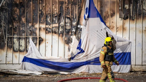 Firefighters at the site of warehouses destroyed in a Hezbollah missile attack, Kiryat Shmona, Sept. 24, 2024. Photo by Ayal Margolin/Flash90.