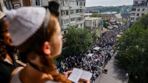 Jewish men in the street during the Tikkun HaKlali recitation of Psalms near the tomb of Rabbi Nachman of Breslov in Uman, Ukraine, on the eve of Rosh Hashanah, Sept.15, 2023. Photo by Chaim Goldberg/Flash90.