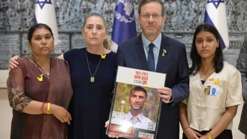 (From L-R): Padma Joshi, Michal Herzog, President Isaac Herzog holding a picture of Gaza hostage Bipin Joshi, and Pushpa Joshi, at the President's Residence in Jerusalem Credit: Amos Ben Gershom / GPO, August 17, 2025.