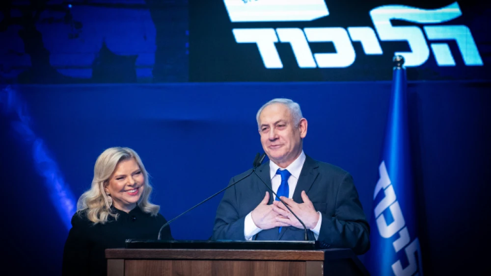 Israeli Prime Minister Benjamin Netanyahu and his wife, Sara, address supporters on the night of the Israeli elections at Likud Party headquarters in Tel Aviv, March 2, 2020. Photo by Olivier Fitoussi/Flash90.