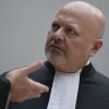 Chief Prosecutor Karim Khan talks prior to the first appearance of former Philippine President Rodrigo Duterte before the International Criminal Court (ICC) on charge of crimes against humanity over his deadly crackdown on narcotics, in The Hague on March 14, 2025. Photo by Peter Dejong/Pool/AFP via Getty Images.