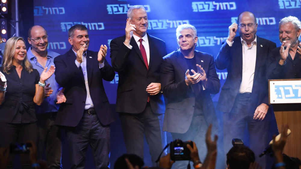 Blue and White Party chairman Benny Gantz with party members at campaign headquarters on election night in Tel Aviv, Sept. 18, 2019. Photo by Hadas Parush/Flash90.