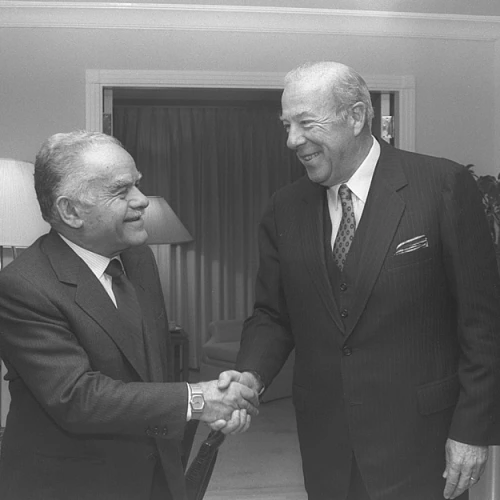 Israeli Prime Minister Yitzhak Shamir greets longtime friend of the Jewish state George Shultz, one of two men to have served in four different U.S. cabinet positions. Credit: Herman Chanania/GPO.