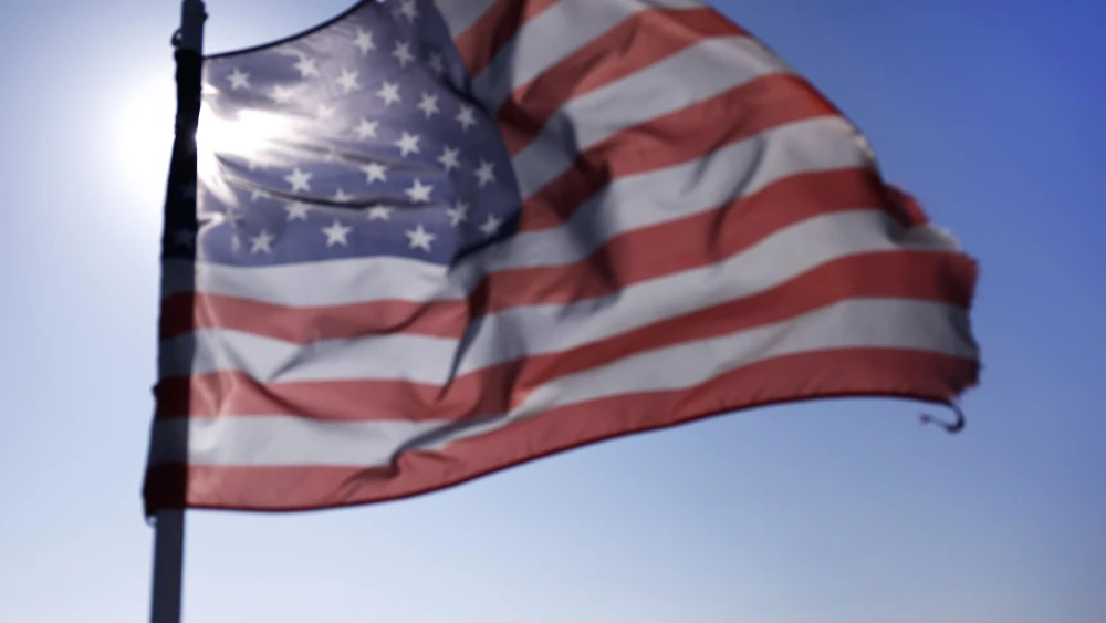 An American flag flies from a tour boat off the shore of the Port of Long Beach, May 8, 2026. Photo by Mario Tama/Getty Images.