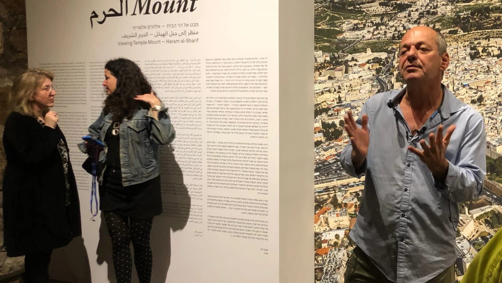 Shimon Lev, curator in front of “The Mount: A Photographic Journey to Temple Mount Temple Mount compound, Dome of the Rock.” Credit: Judy Lash Balint.