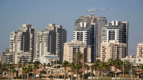 A view of new high-rise apartment buildings next to older small homes in the southern Israeli city of Ashdod on Sept. 2, 2019. Photo by Gershon Elinson/Flash90.
