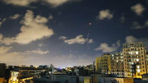 An Iron Dome interceptor rocket flies above the Tel Aviv skyline as seen from a rooftop on July 17, 2014. Credit: Matanya Tausig/Flash90.