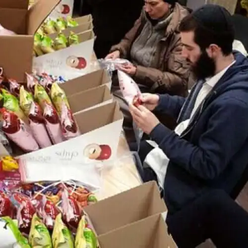 Chabad members in Kishinev, Moldova, prepare for Purim. Credit: Courtesy.