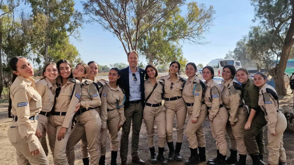 Flemish Interest lawmaker Sam Van Rooy with Israel Defense Forces troops in southern Israel, December 2024. Credit: Courtesy.