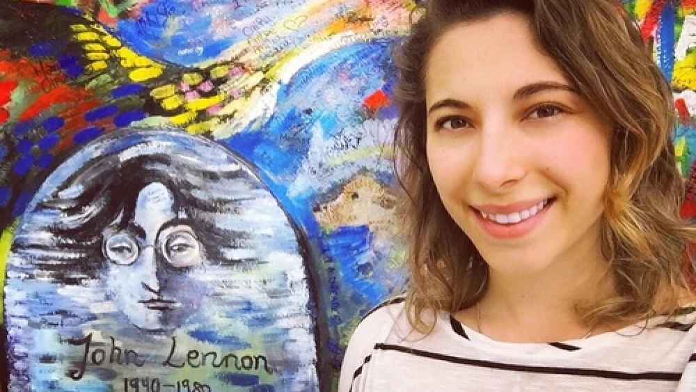 Click photo to download. Caption: Eliana Rudee at the Lennon Wall in Prague. Credit: Courtesy Eliana Rudee.