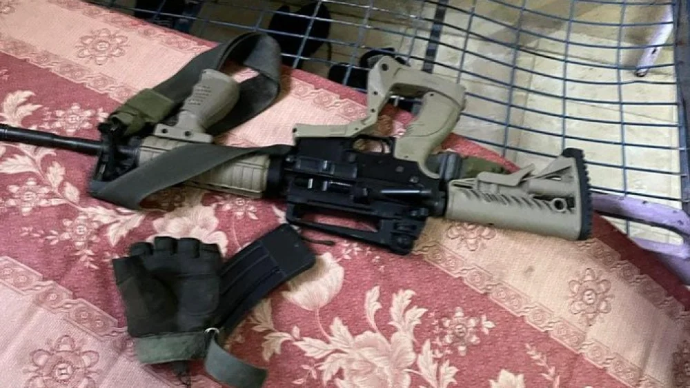 An M-16 rifle found at the home of a terror suspect in the Balata refugee camp during an arrest raid on March 15, 2022. Credit: Israel Police.