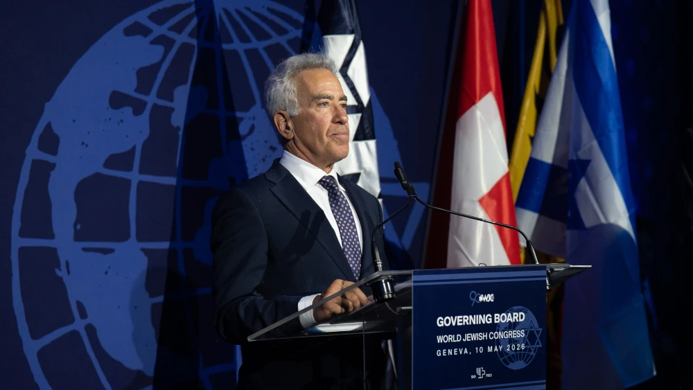 Sylvan Adams, president of the World Jewish Congress Israel Region, speaks about the family of Ran Gvili during the WJC 90th anniversary gala in Geneva, saying Gvili’s memory “is now forever part of the story of Jewish courage and resilience,” May 11, 2026. Photo by Shahar Azran/WJC.