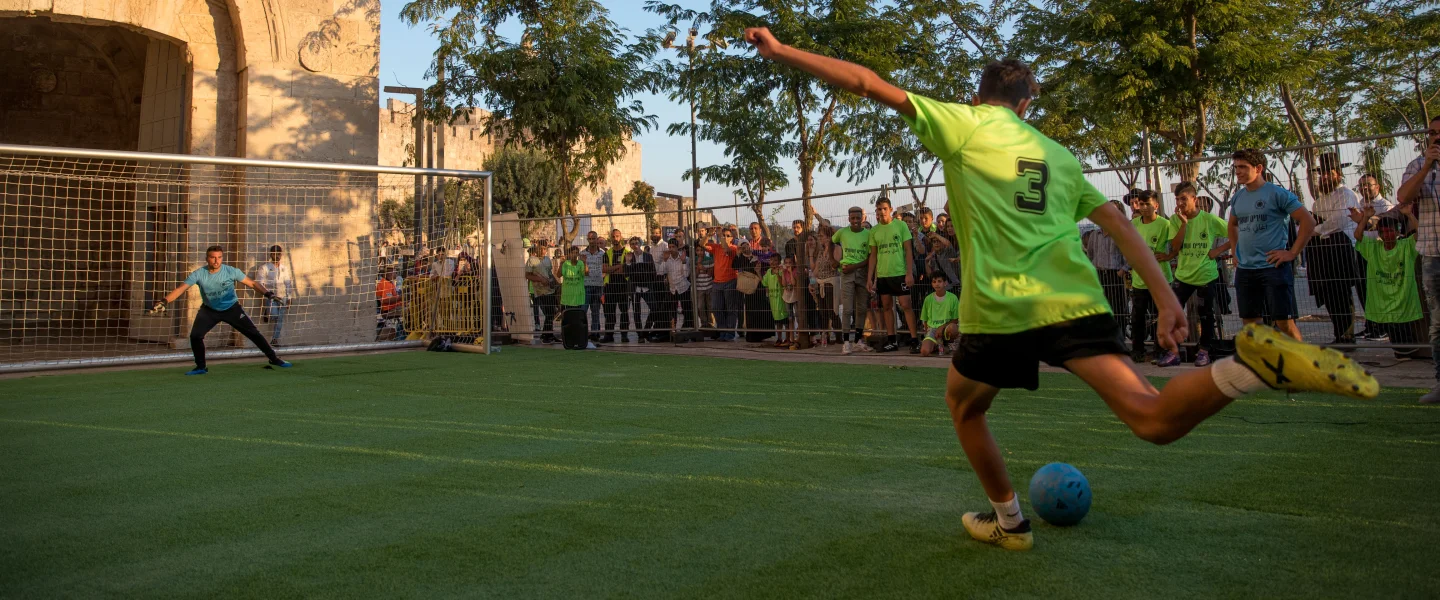 Youth participate in a penalty shootout tournament as part of the World Cup celebrations at Jaffa Gate in the Old City of Jerusalem on July 10, 2018. Photo by Yonatan Sindel/Flash90.